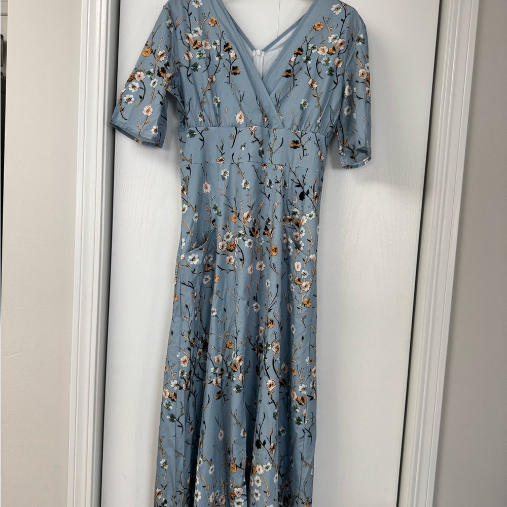 Women’s v-neck maxi dress with floral print on medium dusty blue . Size M